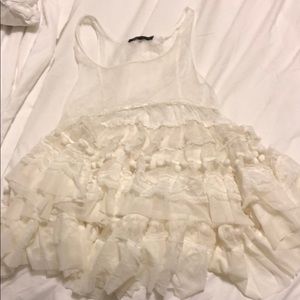 Sheer BCBG top with poms